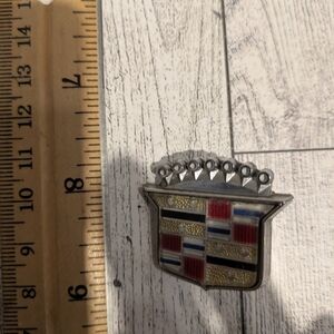 Cadillac Silver and Red Car Emblem